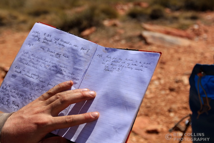Signing the summit register on Brinkley Bluff, Larapinta Trail, Australia
